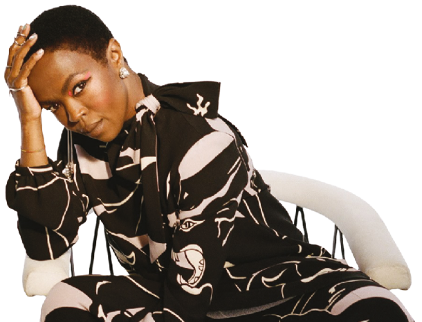 Ms. Lauryn Hill sitting in a chair